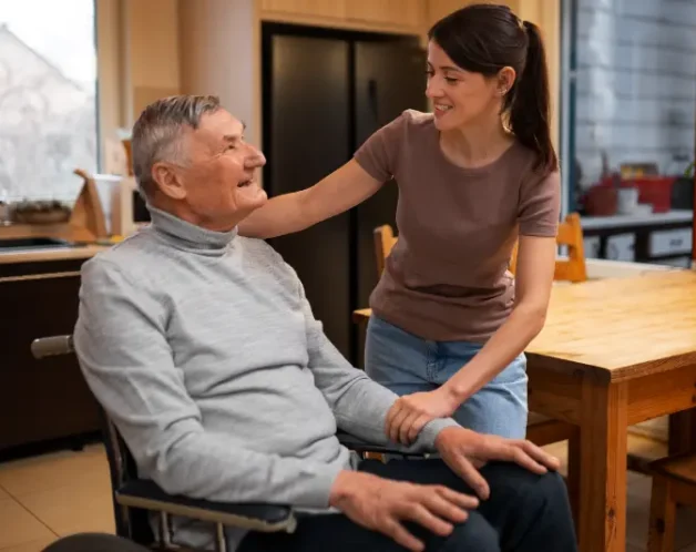 elderly-person-being-taken-care-by-female-caretaker elderly-person-being-taken-care-by-female-caretaker
